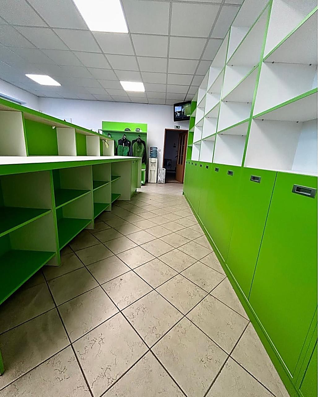 Venue Vision Nakuru — Bright green retail shelving and display units for the Venue Vision store in Nakuru — commercial fit-out by Epique Interiors.